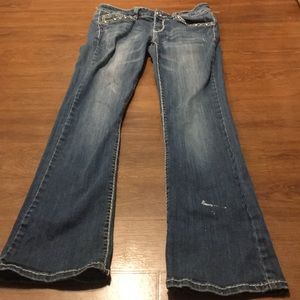 Good condition blue jeans with gem design.